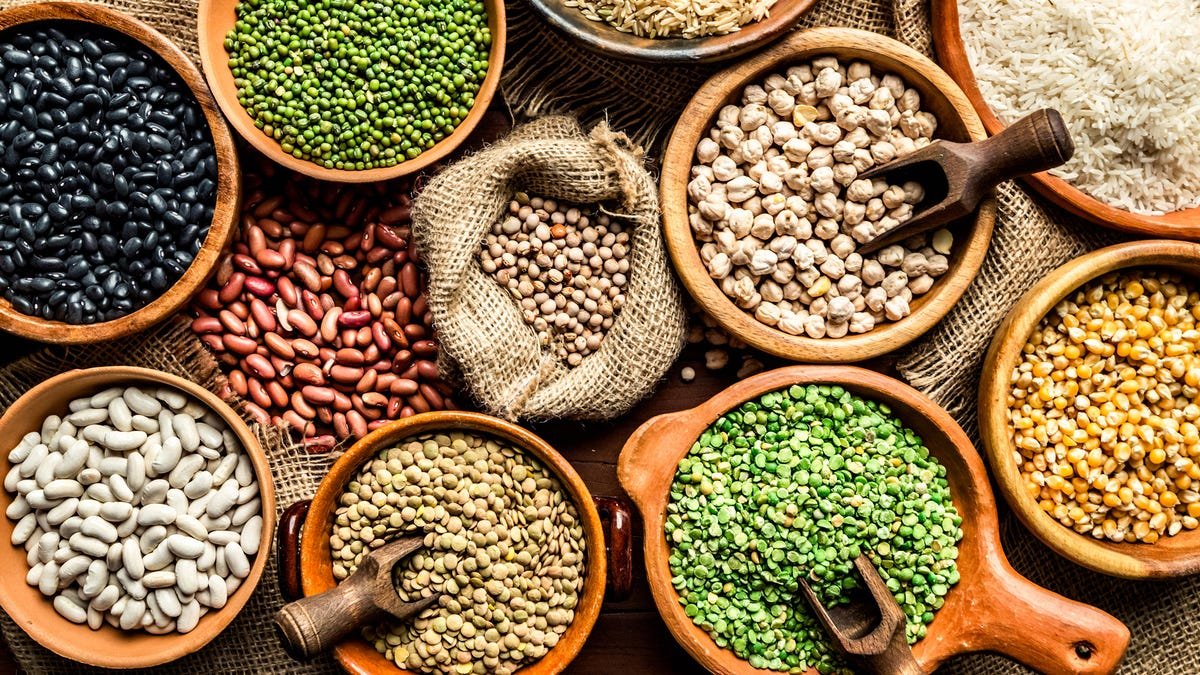 Top view of beans, seeds on rustic wood table