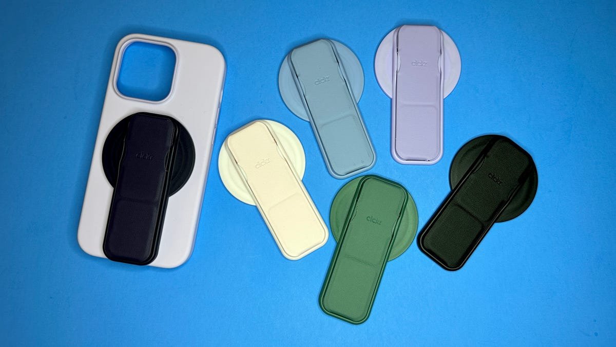 Several Clckr phone grips against a blue background.