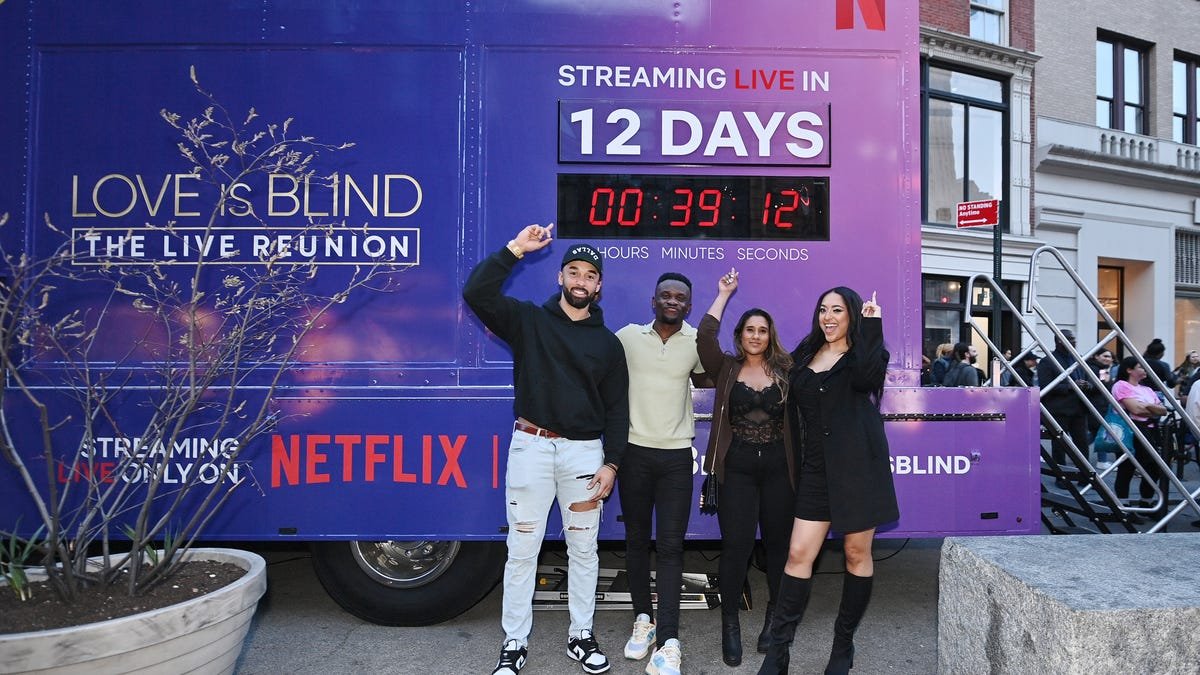 Love is Blind cast members stand in front of a purple truck