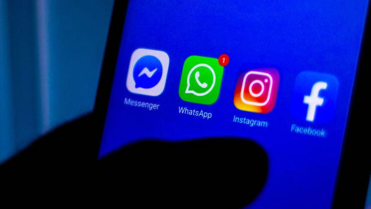 Smartphone showing Messenger, Instagram, Facebook and WhatsApp icons