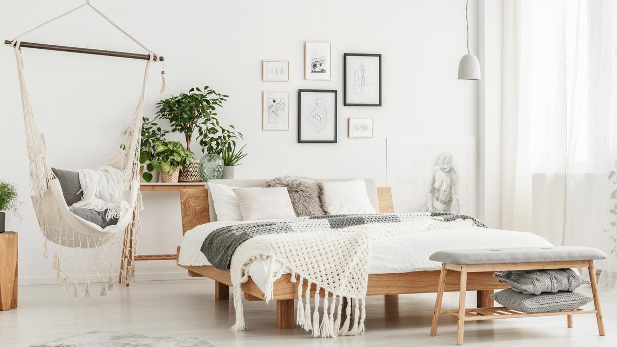 Oversized bed in staged room.