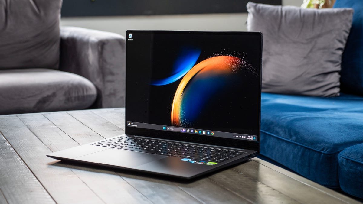 Samsung Galaxy Book 3 Ultra 16-inch laptop on a gray wood table.